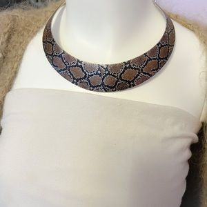 Snakeskin collar necklace.